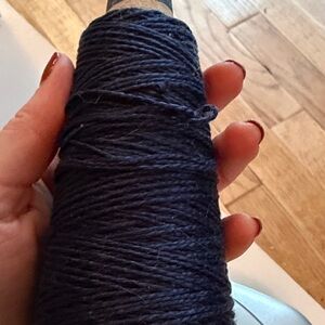 Dark blue mercerized cotton yarn on a cone 2.5 ounces